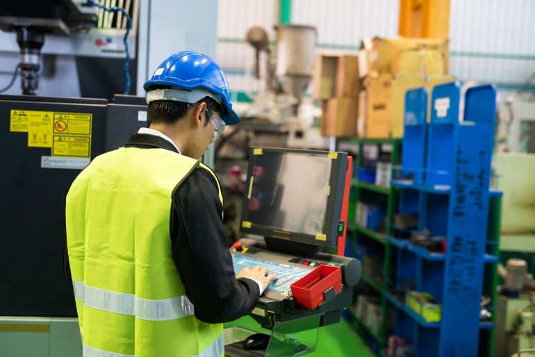 A production operative using a factory based IT system