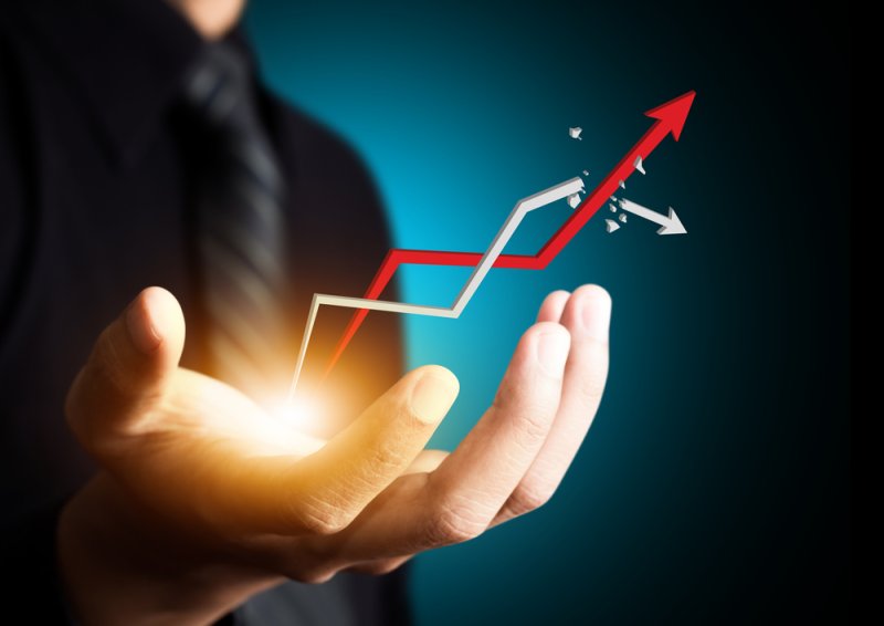 Upward growth graph jumping out of a man's hands | Martec International