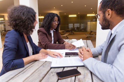 business-partners-consulting-legal-expert-outdoor-cafe